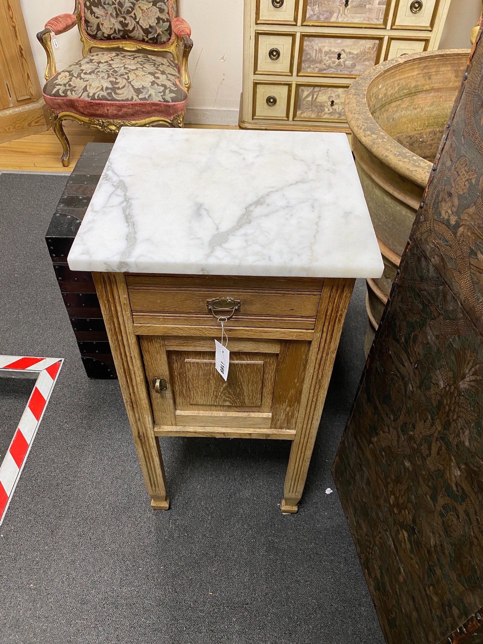 An early 20th century Continental oak marble top bedside cabinet, width 42cm, depth 39cm, height 85cm